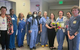 Lovie Bolton wit team receiving award