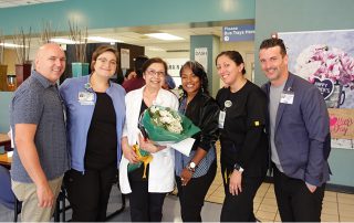 Group celebrating daisy winner