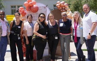 CEO James Jacksong and staff at glowing, growing, afterglow graduation.