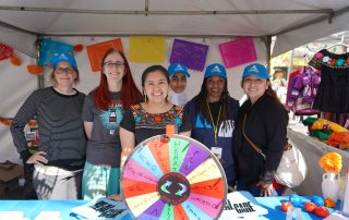 AHS staff tabling at Dia De Los Muertos event 2024.