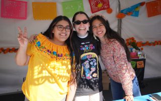 AHS staff tabling Dia De Los Muertos event 2024